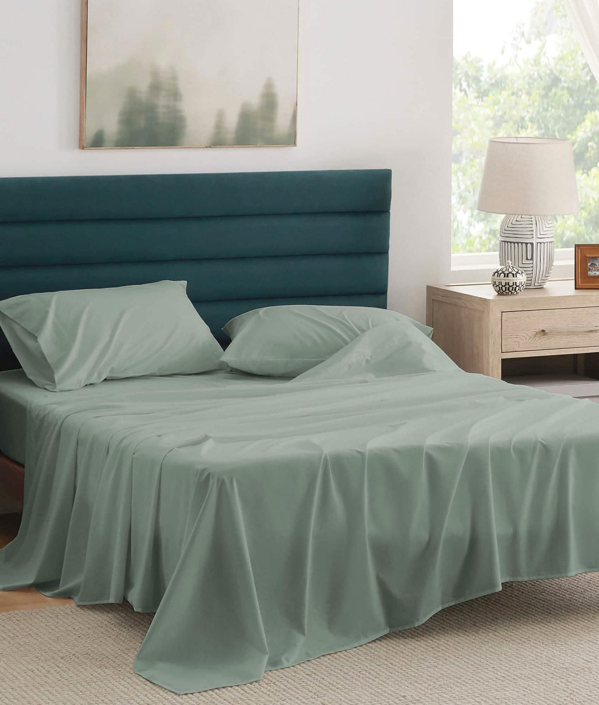 Soft sage green 100% cotton percale weave sheet set on bed