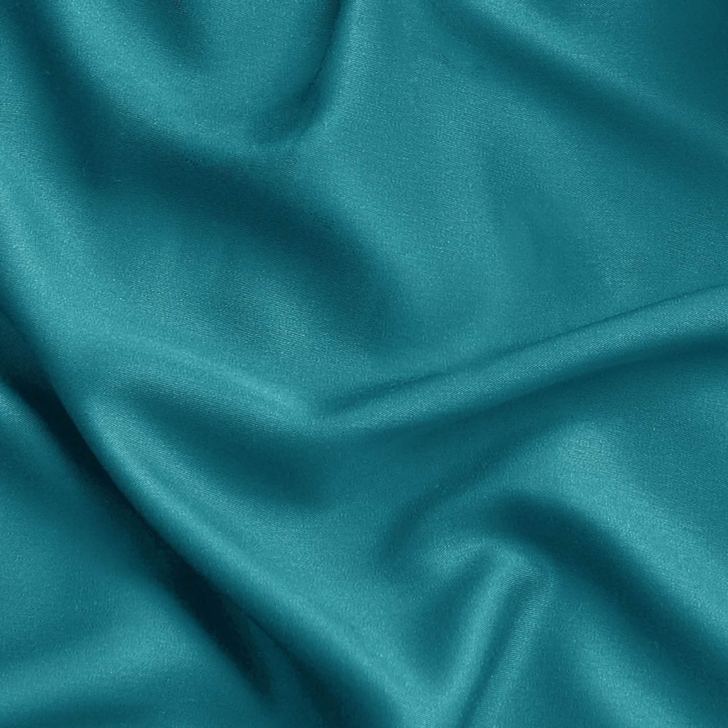Teal blue GentleSoft rayon derived from bamboo fabric texture, showcasing silky smooth finish and elegant drape.