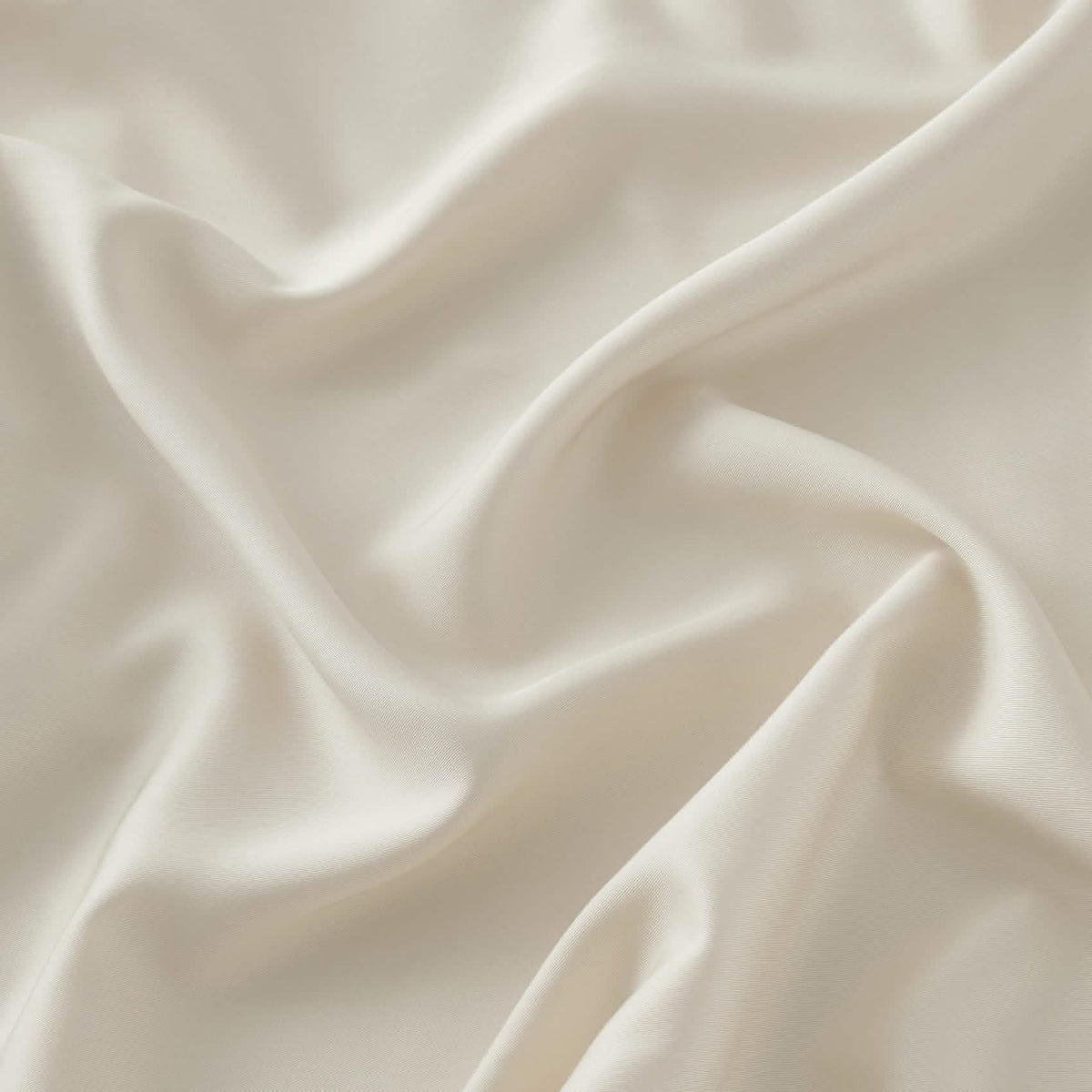 Beige GentleSoft rayon bamboo fabric texture close-up, showcasing silky smooth finish and elegant sheen.