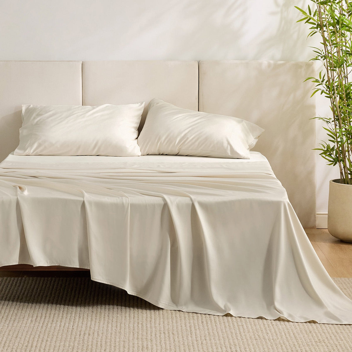 GentleSoft beige rayon bamboo sheet set on bed, showcasing silky smooth texture and elegant sheen.